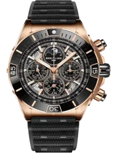 Breitling wristwatch with a rose-gold case, black bezel, skeleton dial revealing multiple subdials, and a black textured strap.